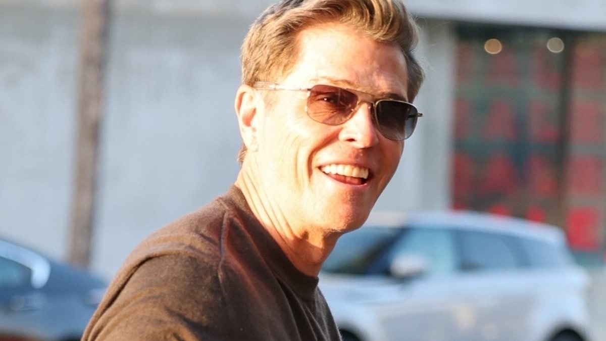 EXCLUSIVE Patrick Whitesell is all smiles as he enjoys lunch with friends in LA - while ex-wife Lauren Sanchez weds Jeff Bezos in Venice