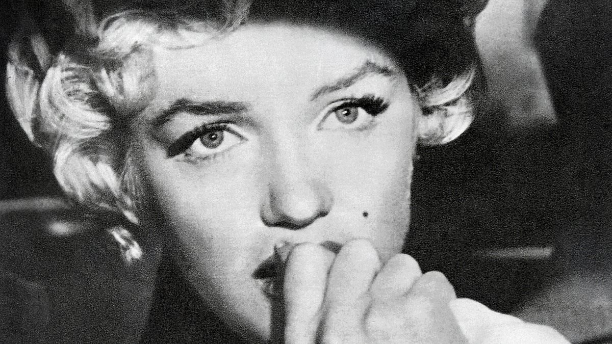 'I know a lot of dangerous secrets about the Kennedys. I will shock the world': Marilyn Monroe's ominous words before she was found naked and dead in bed... so was she murdered to silence her?