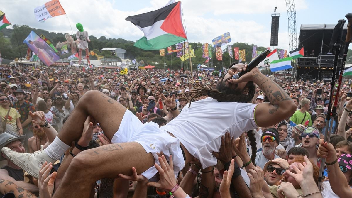 EXCLUSIVE Tel Aviv blasts BBC for failing to cut hour-long live broadcast of punk band's vile outburst - as police face demands to arrest Bob Vylan singer who led 'death to Israeli soldiers' chants at Glastonbury