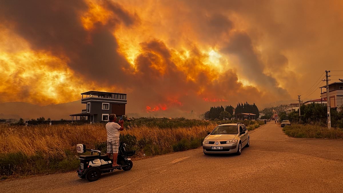 Travel chaos as wildfires tear through holiday hotspot and ground all flights leaving 100s of passengers stranded