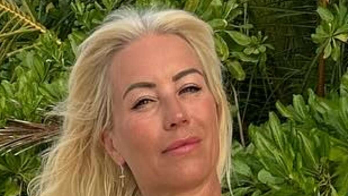 Denise Van Outen 'absolutely smitten' with new boyfriend Adam Butler as they're seen 'holding hands' during their first public outing at Glastonbury