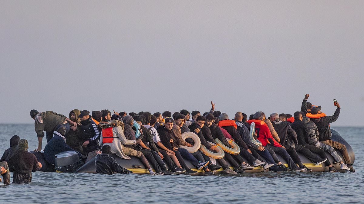 Grinning Channel migrants pose for SELFIES on packed dinghy as total tops 170,000 since start of crisis - and expert warns French powers to stop boats will make no difference to illegal arrivals