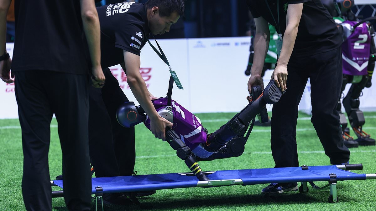 Footballers, your jobs are safe for now: Watch as China's first 3-on-3 robot football match kicks off (and ends with two bots being stretched off the pitch!)