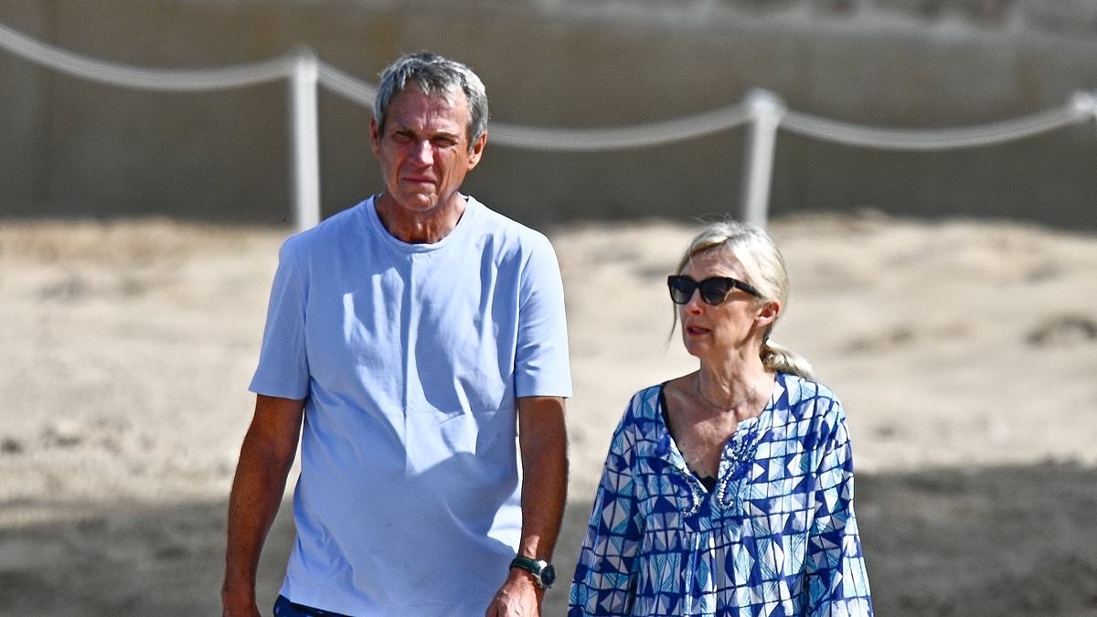 Liverpool legend Alan Hansen, 70, looks fit and healthy as he enjoys sun-soaked stroll with his wife at exclusive Barbados hotel