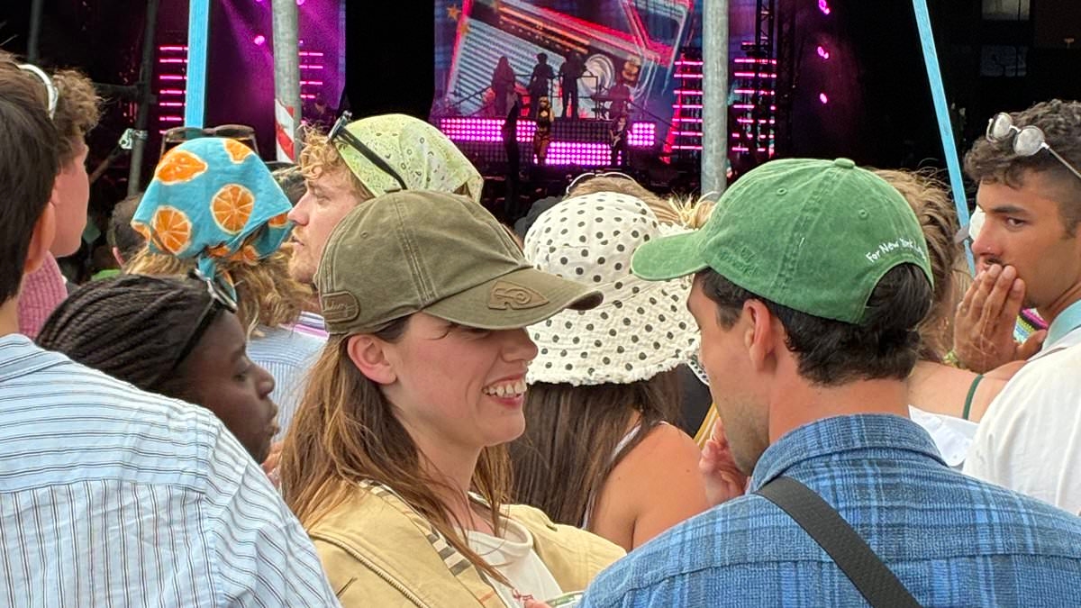 Aimee Lou Wood puts on a cosy display with boyfriend Adam Long as they party together at Glastonbury after romance was revealed
