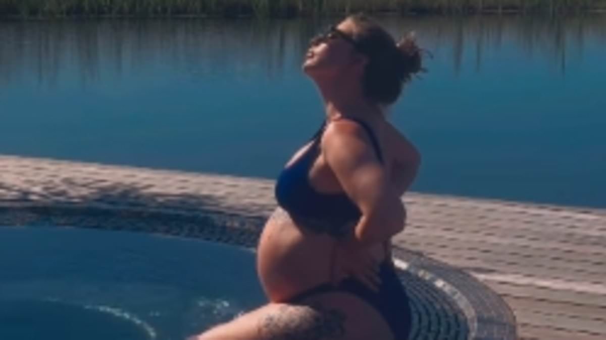 Pregnant Olivia Bowen displays her growing bump in a navy bikini as she soaks up the sun during loved-up babymoon with husband Alex