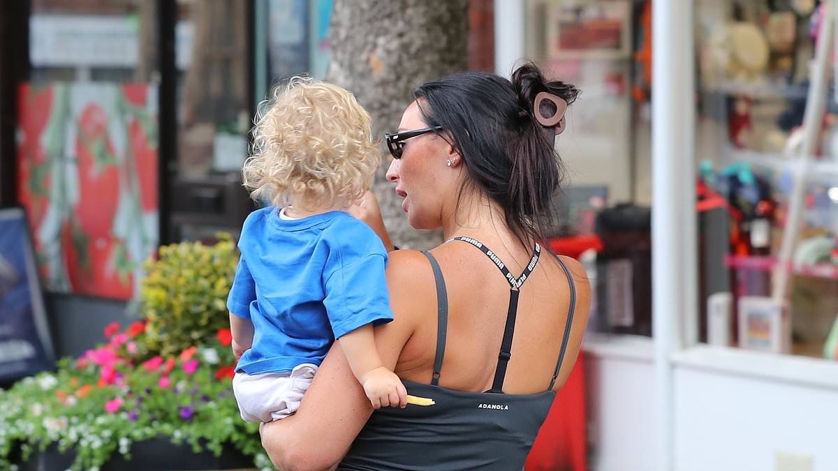 Annie Kilner carries son Rezon, 8-months, as she heads out for lunch with Kyle Walker in Cheshire as they get their marriage on track after divorce fears