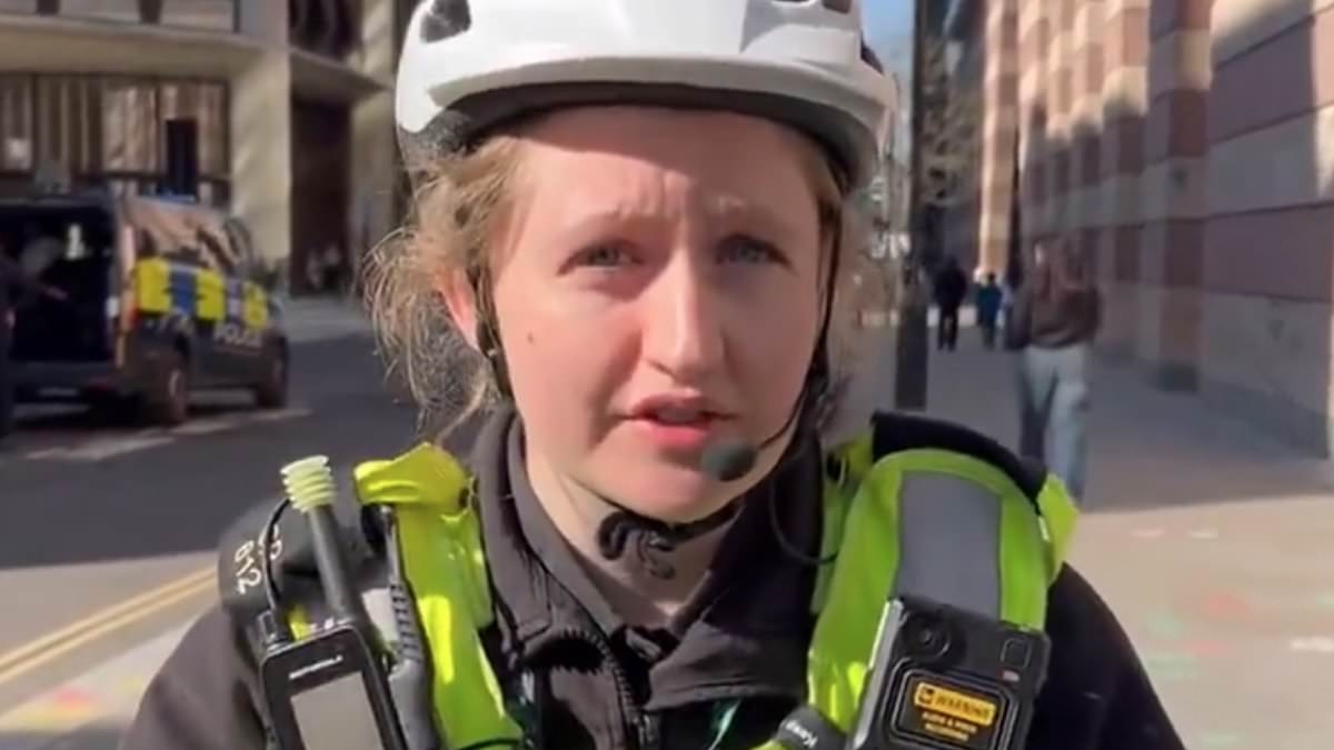 Moment cyclist ticketed for 'riding no handed' confronts City of London officer over his fine - but who do YOU think was in the wrong?
