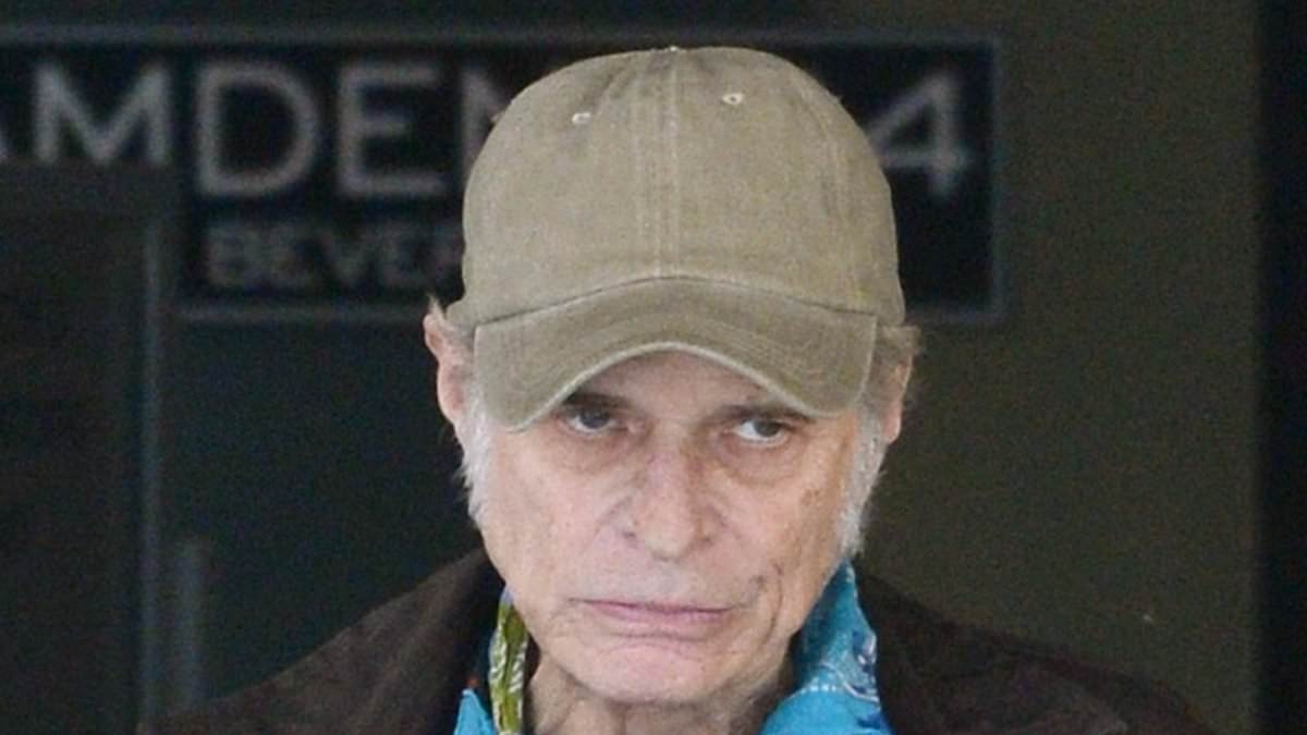 EXCLUSIVE Rock legend is unrecognizable as he enjoys a rare outing in LA... can you guess who it is?
