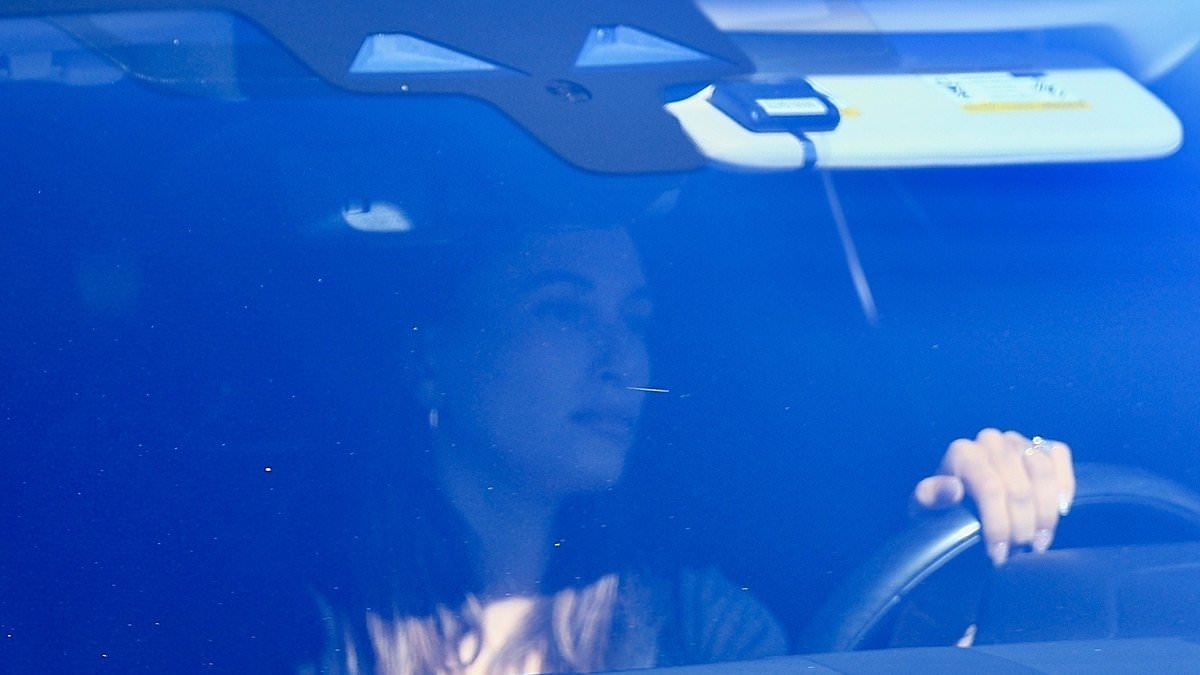 Hailey Bieber looks downcast as she is seen for the first time since being mocked over her Rhode beauty 'tampon holder' accessory