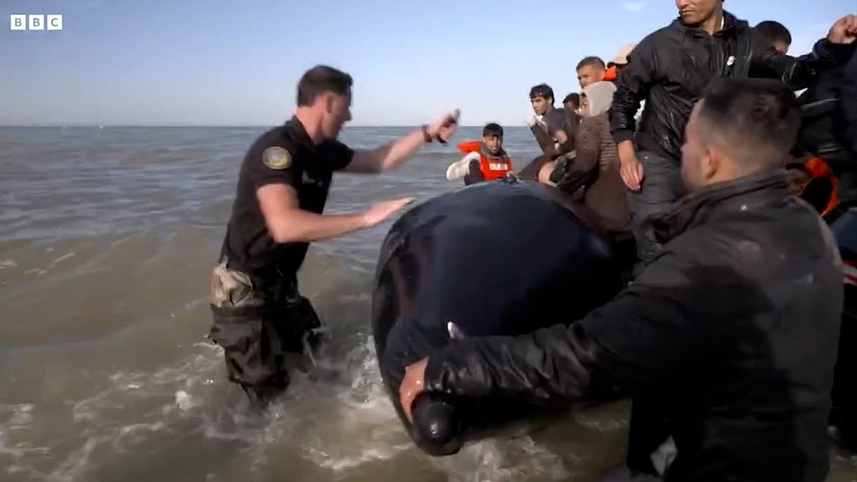 French police slash migrant boat and drag passengers back to shore just as they attempt to set across the Channel for Britain