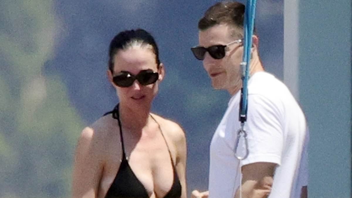 EXCLUSIVE Newly single Katy Perry has VERY flirty exchange with mystery man on yacht after Orlando Bloom split