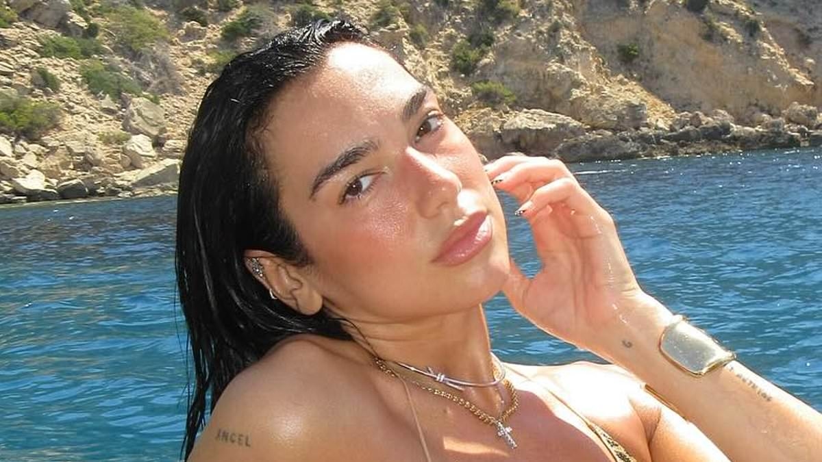 Dua Lipa sets pulses racing in a skimpy leopard print bikini displaying her chiselled abs as she basks in the sun on a luxury yacht in Mallorca