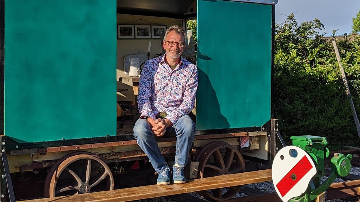 Retired rail engineer, 64, builds a £2,000 50ft-long functioning railway in his back garden