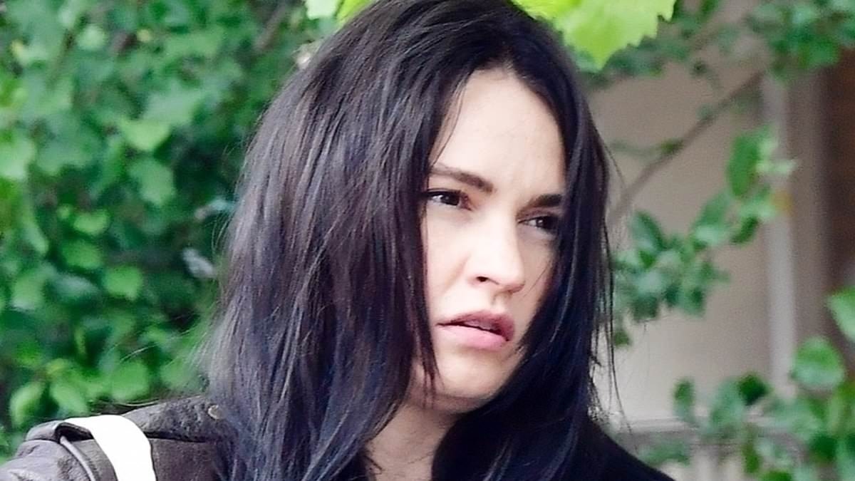 Lily James ditches typically elegant style for a new gothic look as she hits the streets in London
