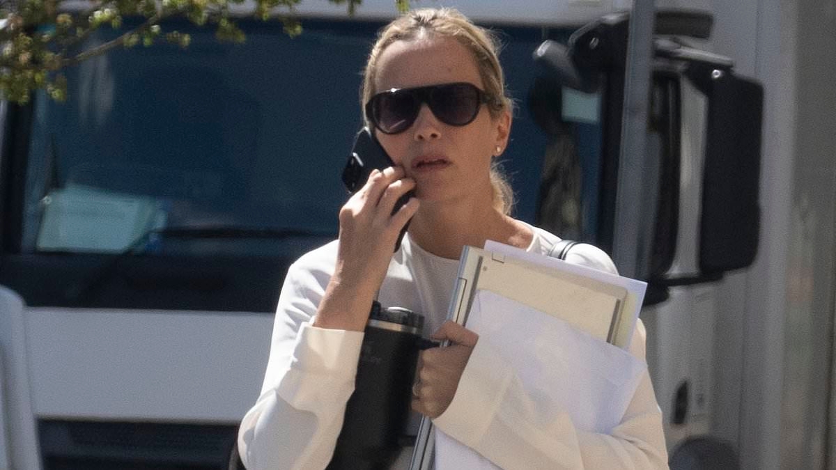 Boss of designer shoe brand Jimmy Choo is banned from driving after being caught driving her £72k Audi without insurance