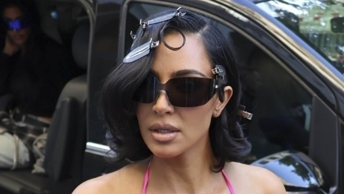 Kim Kardashian puts on a VERY busty display as she goes braless beneath a plunging pink dress while arriving for a Balenciaga fitting in Paris