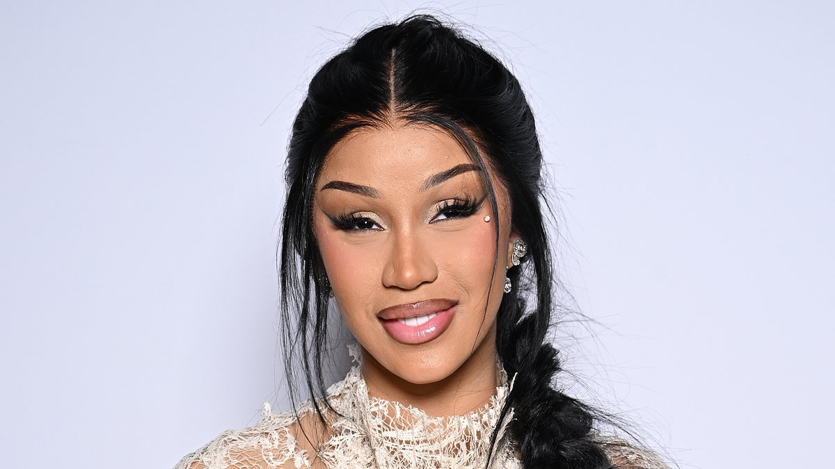 Cardi B wears a semi-sheer lace gown as she opts for a more understated look after turning heads with bizarre outfits during Paris Fashion Week