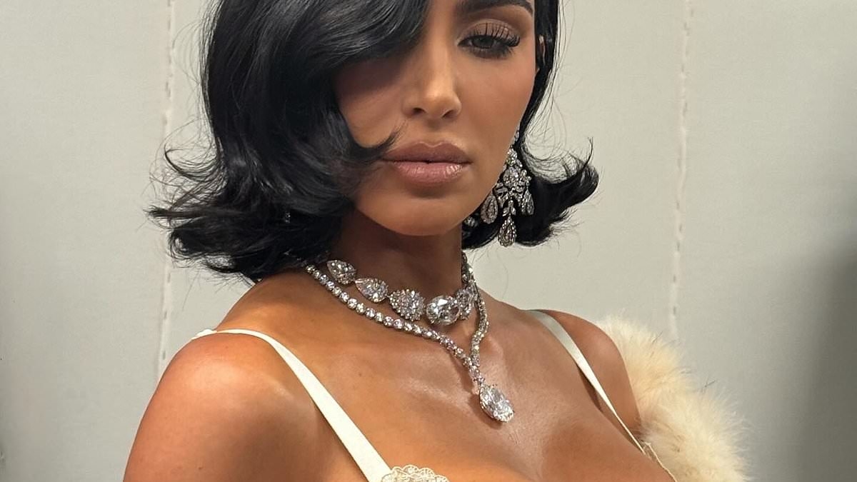 Kim Kardashian is a busty beauty as she channels idol Elizabeth Taylor in slip dress and diamonds