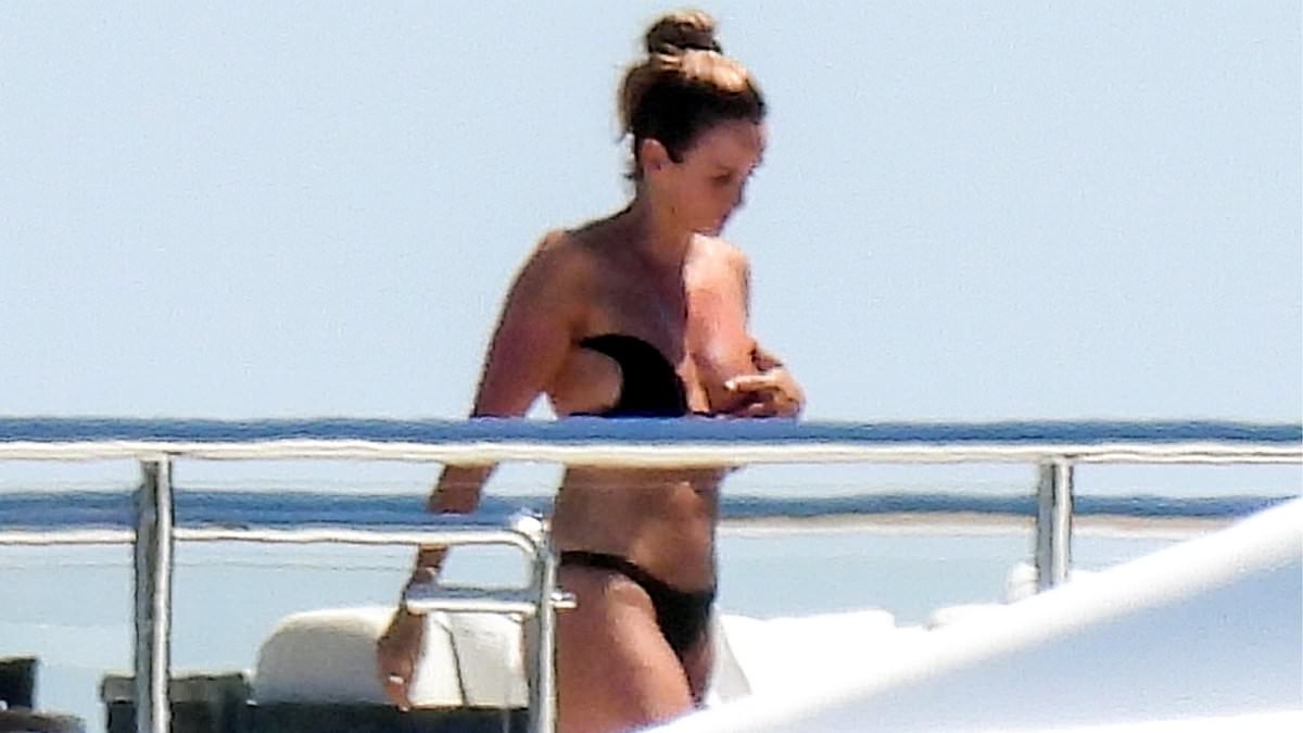 EXCLUSIVE Michael Jordan's daring wife sets pulses racing with risque sunbathing on NBA legend's $115m superyacht