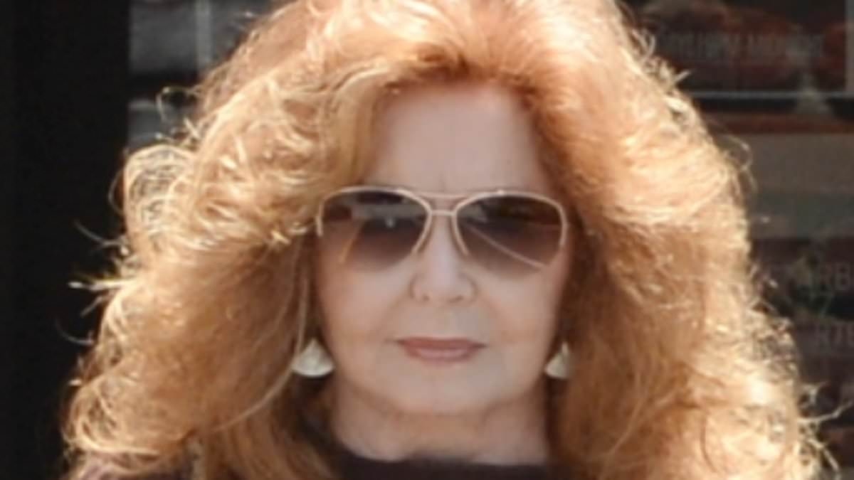 EXCLUSIVE 70s soap legend shows off her famous red curls in rare outing on her 81st birthday... can you guess who?