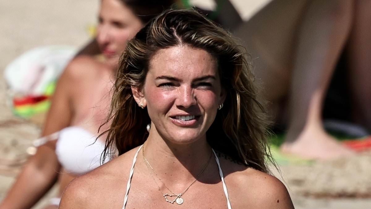 Former X Factor winner Louisa Johnson displays her toned figure in a skimpy crochet bikini as she soaks up the sun in Ibiza