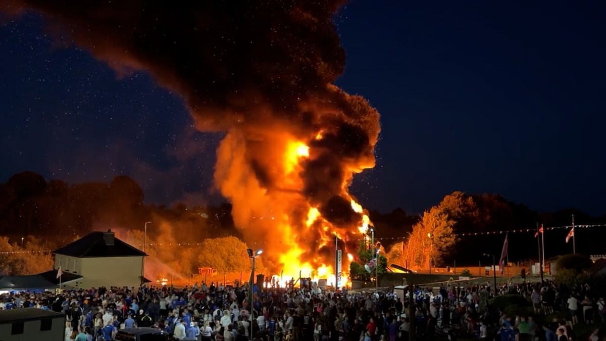 'Racist' bonfire with effigy of migrants in life jackets set alight in Northern Ireland