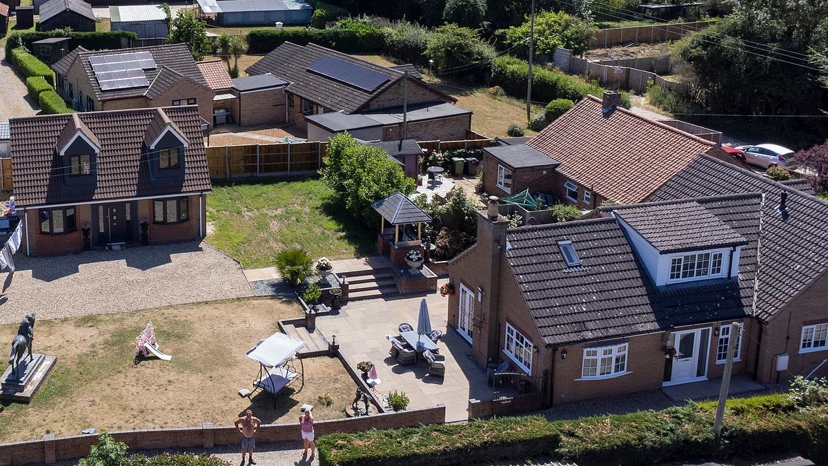 EXCLUSIVE Couple at war with council after converting garage into two-bedroom home because it is NOT CLOSE enough to their home