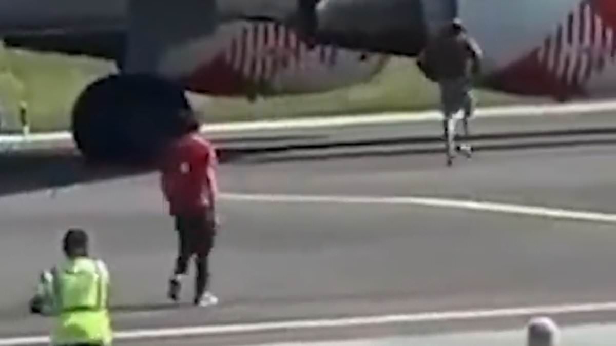 Harrowing last moments of man who jumped into jet engine revealed as video shows how he ran past ground crew and threw himself into turbine