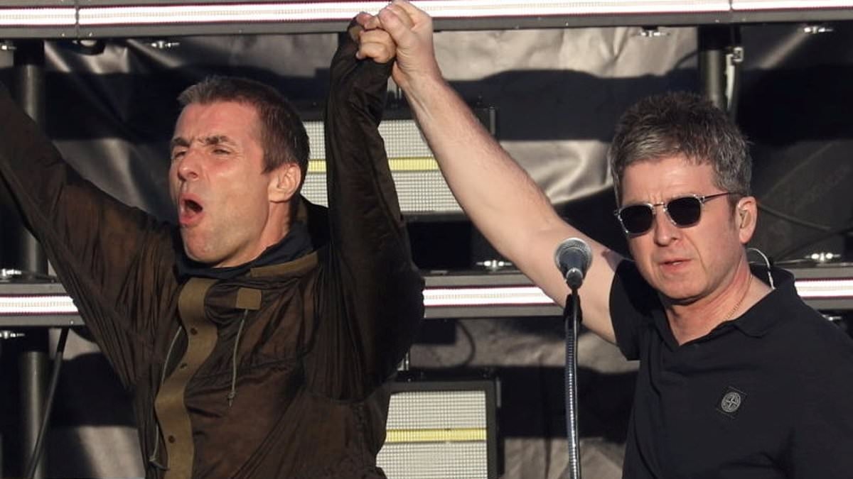 Ticketless Oasis fans 'storm Heaton Park as metal fence panels are knocked down forcing police to intervene'
