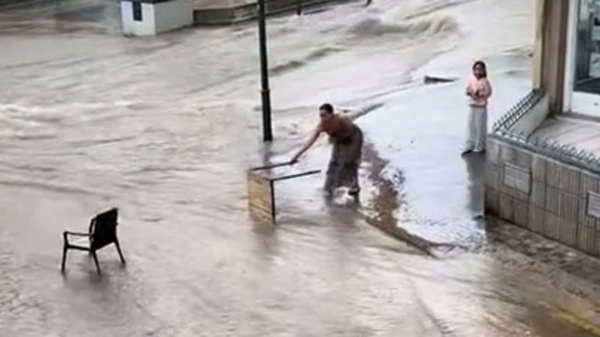 Roads turn into rivers as flood-hit Spain grapples with huge torrents of water and thunderstorms amid Europe's 42C 'heat dome'