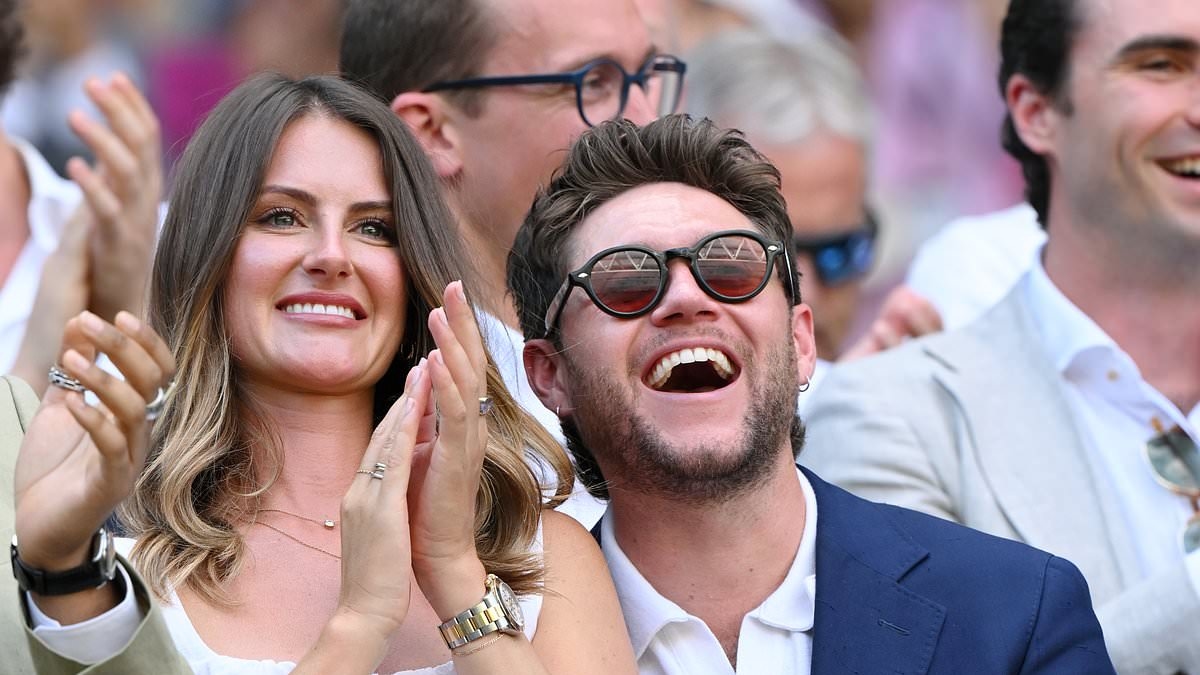 Niall Horan cuddles up to his girlfriend Amelia Woolley as they pack on PDA at the Wimbledon men's final