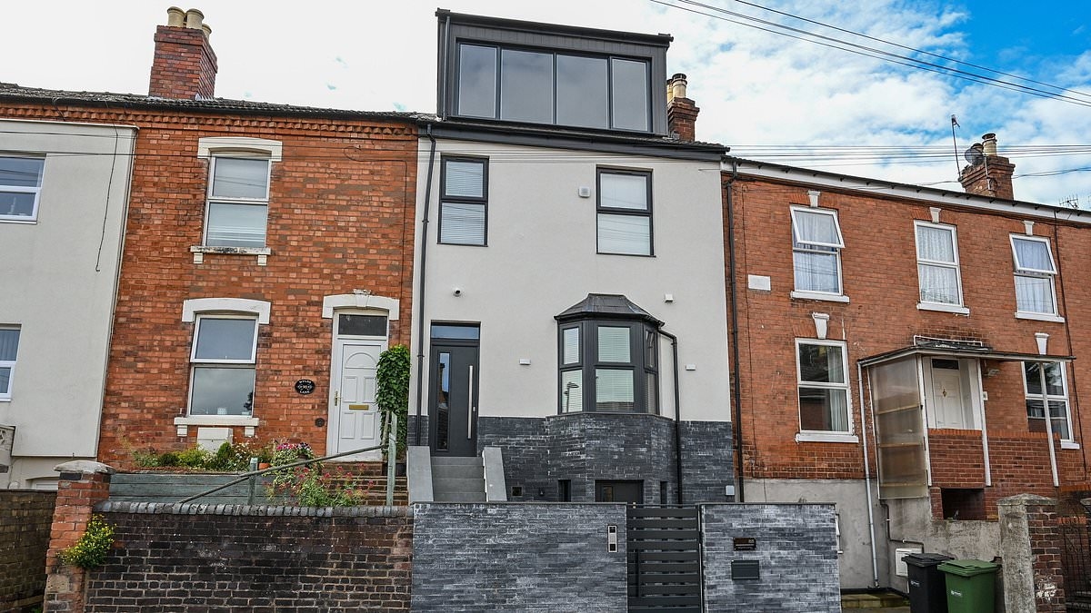 Homeowner ordered to take down dormer extension that looks like a 'football stadium executive box' after neighbours branded it 'a monstrosity'
