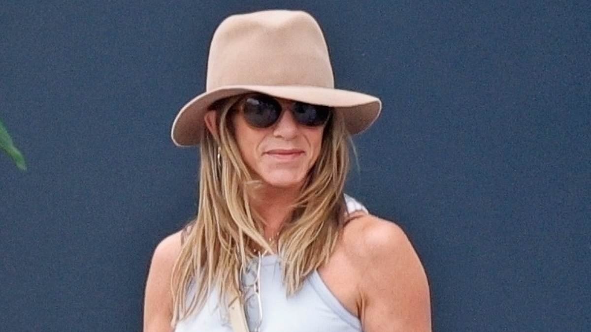 Smitten Jennifer Aniston shows off holiday glow as her new love guru 'boyfriend' makes bold statement about romance