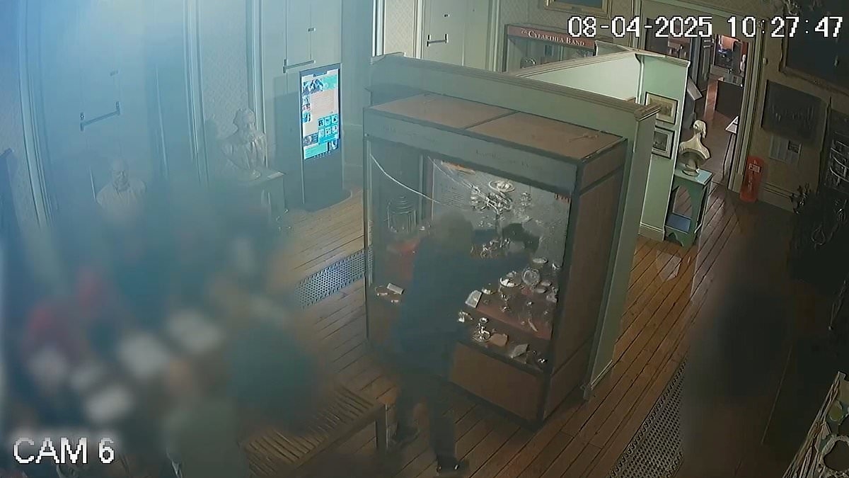 Moment thief smashes glass cabinet and steals £80,000 candelabra inside historic castle - as he is jailed for almost three years