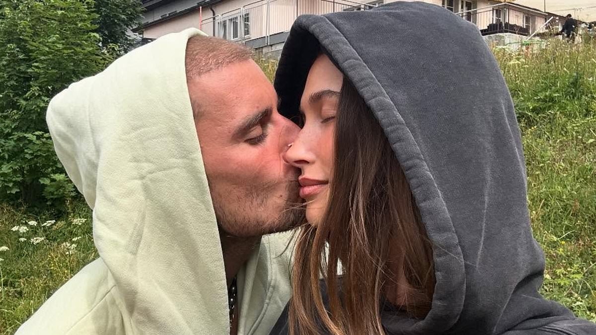 Justin Bieber kisses wife Hailey in Switzerland... after he sang about her 'throwing stones at my back'