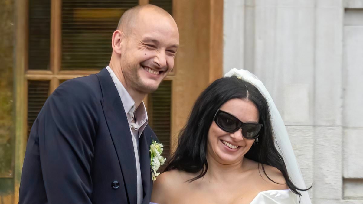 EXCLUSIVE Charli XCX's wedding ring value 'REVEALED': Brat singer continues to defy showbiz traditions with modest band after donning mini dress and shades to tie the knot with The 1975's George Daniel in low key ceremony
