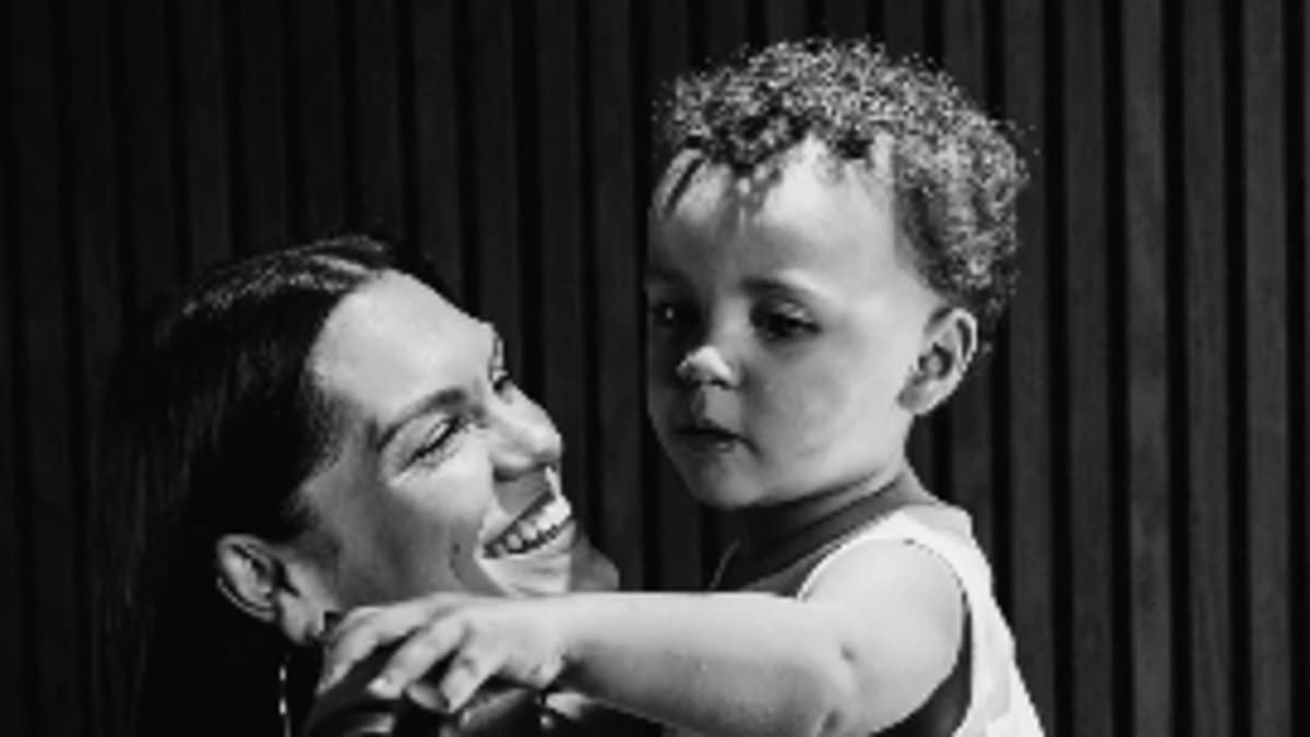 Jessie J shares major health update and admits the worst thing about breast cancer surgery is not being able to hold her son - four weeks after undergoing a mastectomy