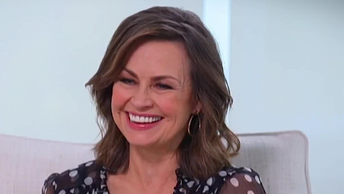 Lisa Wilkinson is caught in her own 'Coldplay kiss cam' moment - but all is not what it seems