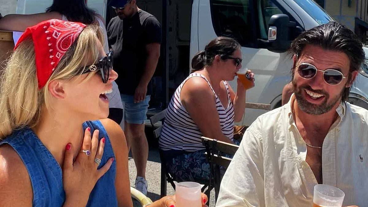 Newly-engaged Emily Atack enjoys romantic getaway with fiancé Alistair Garner as the pair share a kiss while soaking up the sun in France