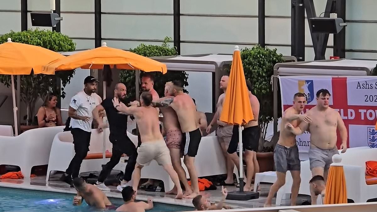Moment fists fly as huge fight breaks out at Benidorm swimming pool with brawlers plunging into the water in front of shocked tourists