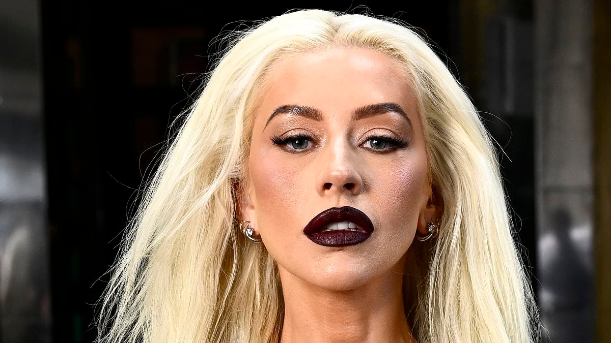 Christina Aguilera, 44, shows off trim frame in an olive green dress as she poses at Burlesque: The Musical