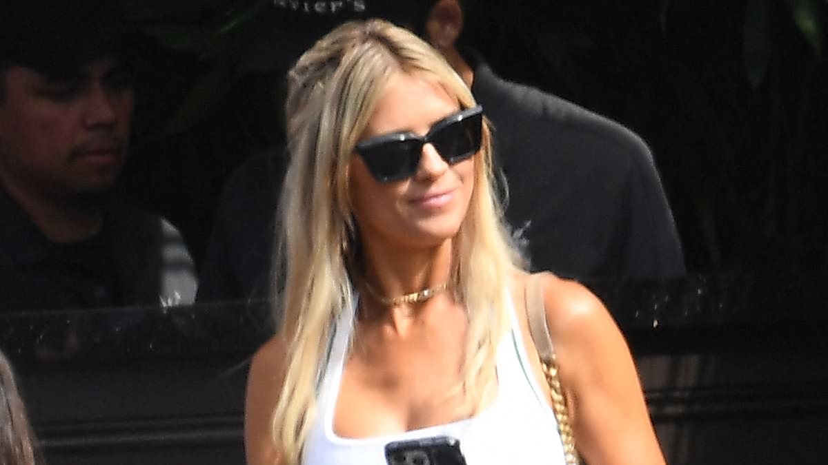 Christina Haack can't keep her hands off new boyfriend Chris Larocca as she models flirty tennis skirt