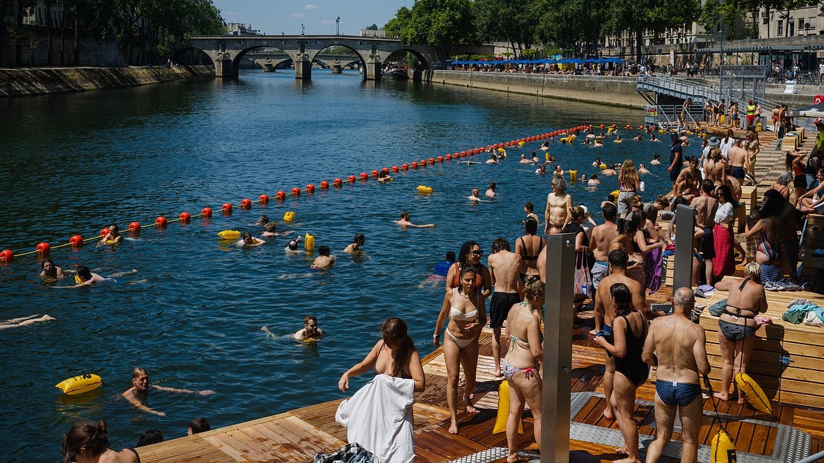 People can finally swim in European city's iconic river after 100-year ban is lifted - but would YOU do it?