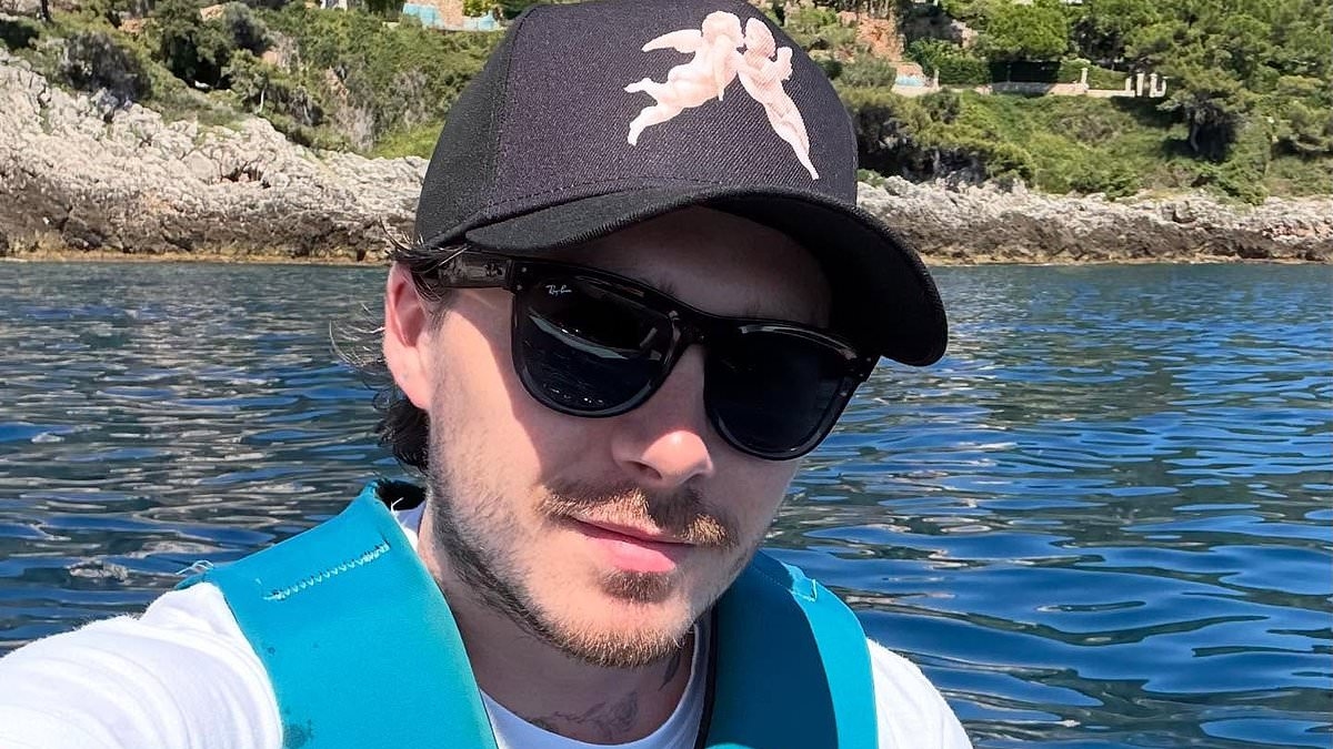 Brooklyn Beckham shares carefree snaps from luxury boat trip as he pokes fun at wife Nicola Peltz's morning ritual amid family feud