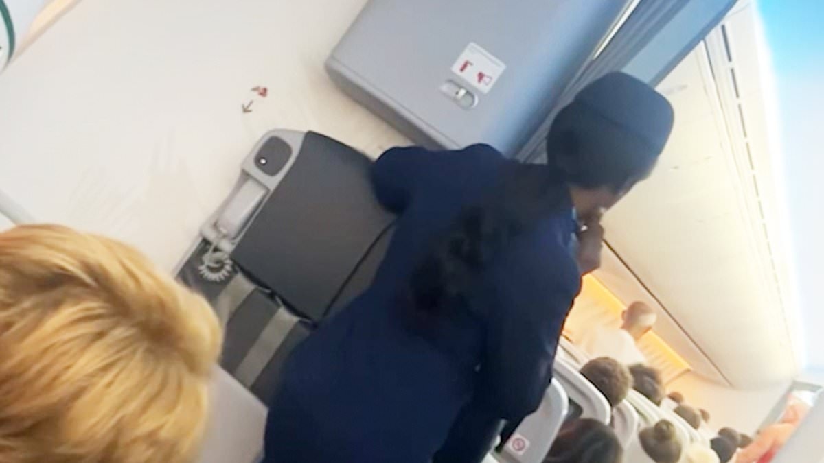 Scary moment plane passenger tries to open cabin doors at 30,000 feet - as screaming passengers feared they were about to die
