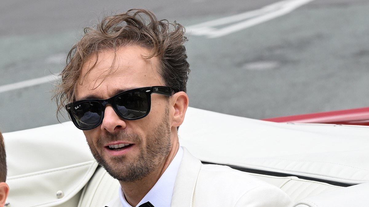 Corrie star Jack P. Shepherd beams as he arrives in a red Mustang ready to tie the knot with fiancée Hanni Treweek at Manchester Cathedral as he's joined by his fellow soap stars