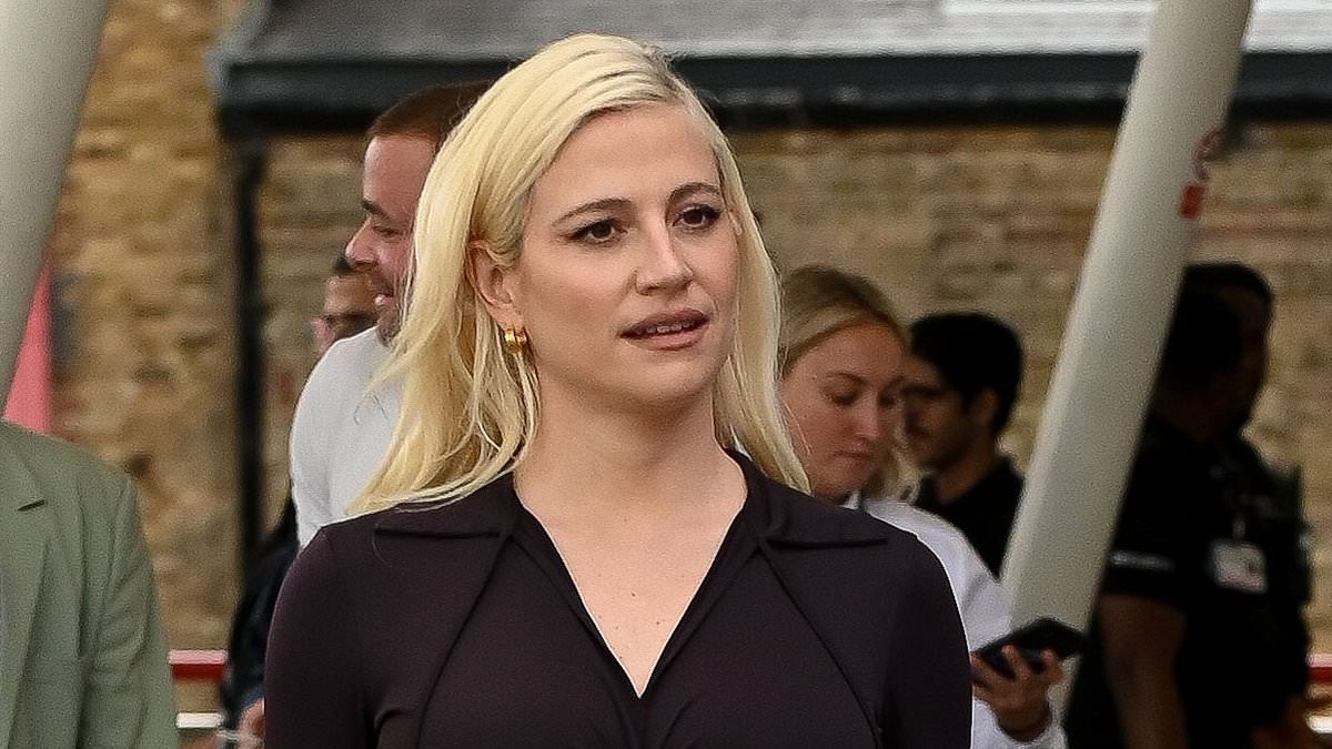 Pregnant Pixie Lott showcases her blossoming bump in slinky black two-piece at Formula E World Championship
