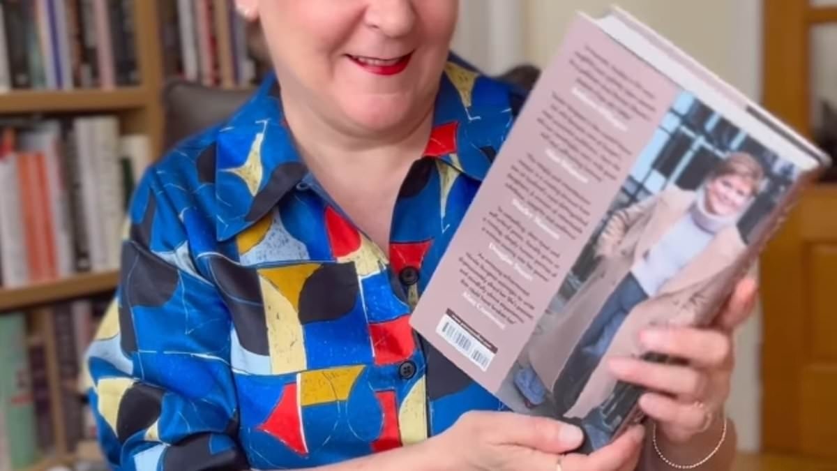 Like an open book! Joy for Nicola Sturgeon as she receives advance copy of her memoir