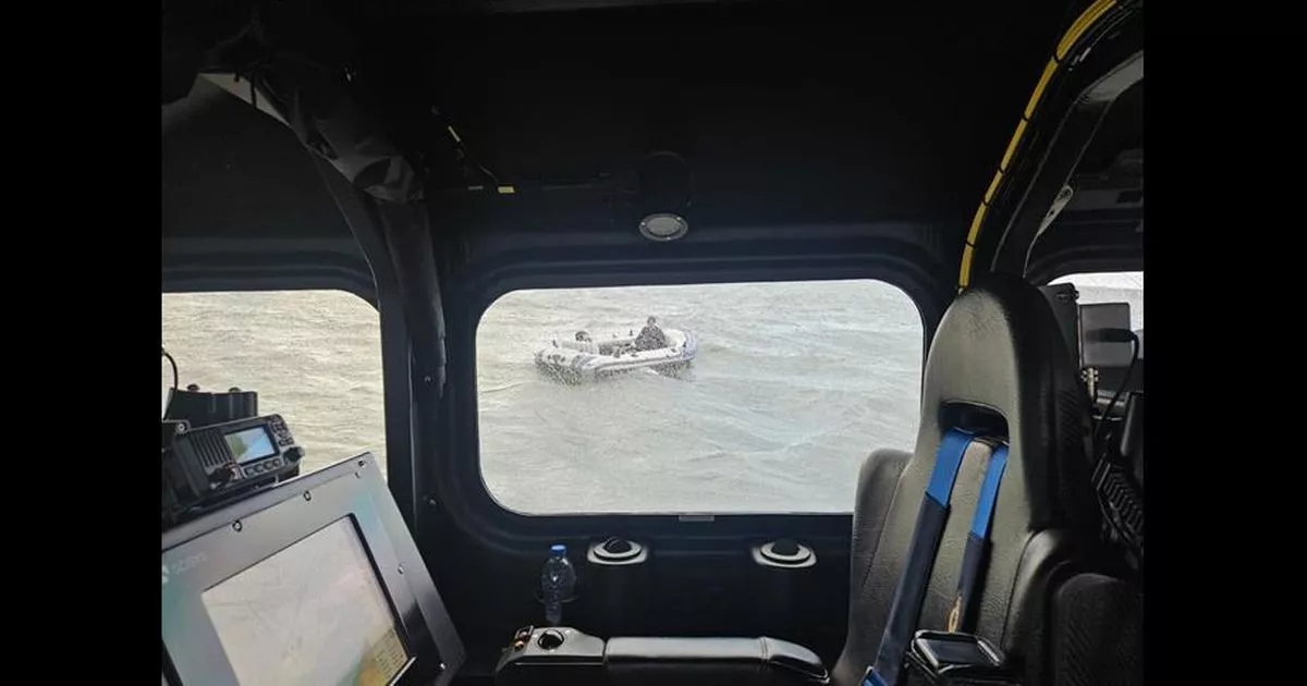 Video shows moment three people miles out to sea on tiny boat are spotted